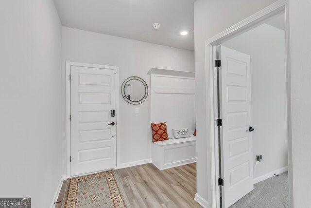 entrance foyer featuring baseboards and light wood-style floors