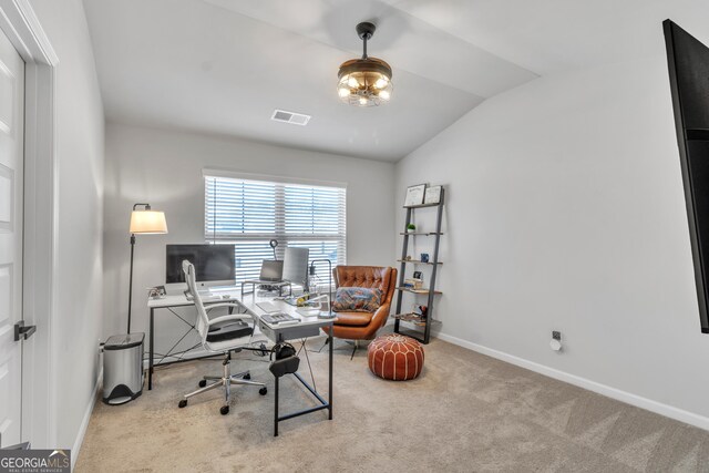 office space with lofted ceiling, carpet, visible vents, and baseboards