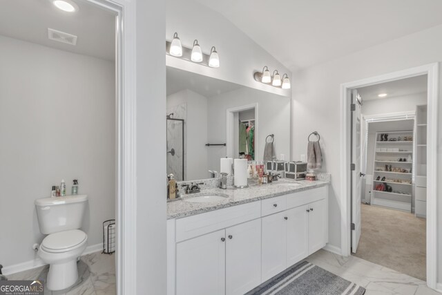 bathroom featuring a shower stall, visible vents, marble finish floor, and a sink