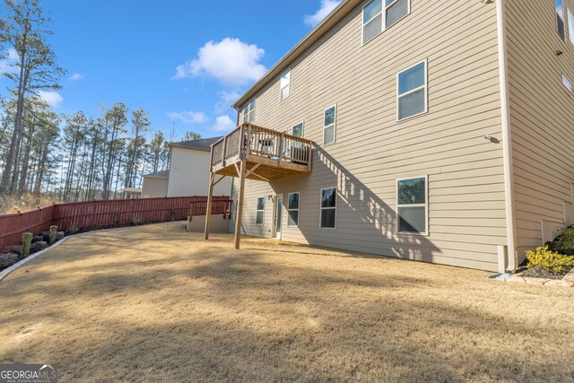 rear view of house with fence