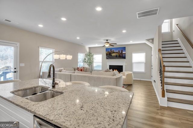 kitchen featuring recessed lighting, visible vents, and a sink