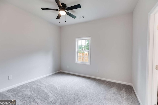 unfurnished room featuring carpet and ceiling fan