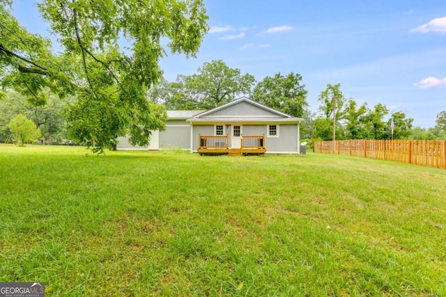 exterior space with a yard and a deck