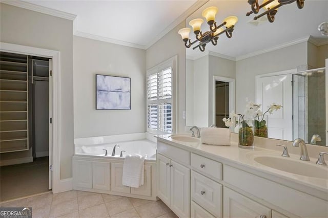 bathroom featuring a chandelier, ornamental molding, vanity, independent shower and bath, and tile patterned flooring