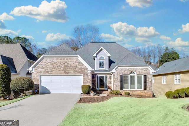 view of front property featuring a garage and a front lawn