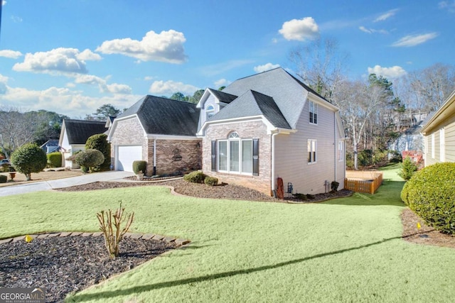 front of property featuring a garage and a front lawn