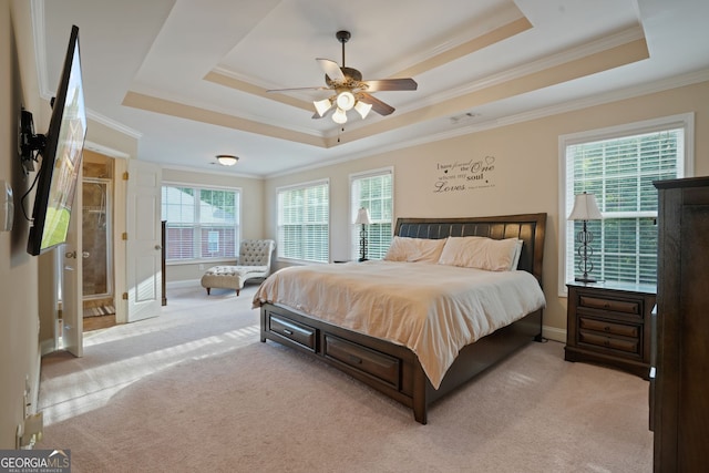 bedroom featuring a tray ceiling, ceiling fan, and crown molding