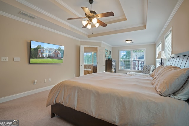 carpeted bedroom featuring ceiling fan, a raised ceiling, and ornamental molding