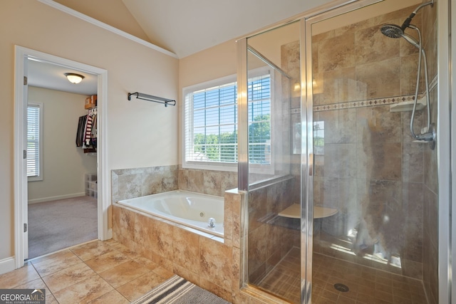 bathroom with lofted ceiling and independent shower and bath