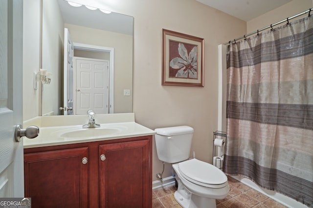 bathroom featuring vanity, toilet, and walk in shower