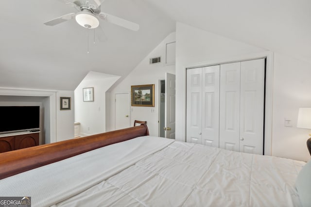 unfurnished bedroom with visible vents, lofted ceiling, ensuite bathroom, a closet, and a ceiling fan