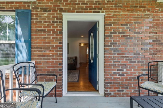 entrance to property with brick siding