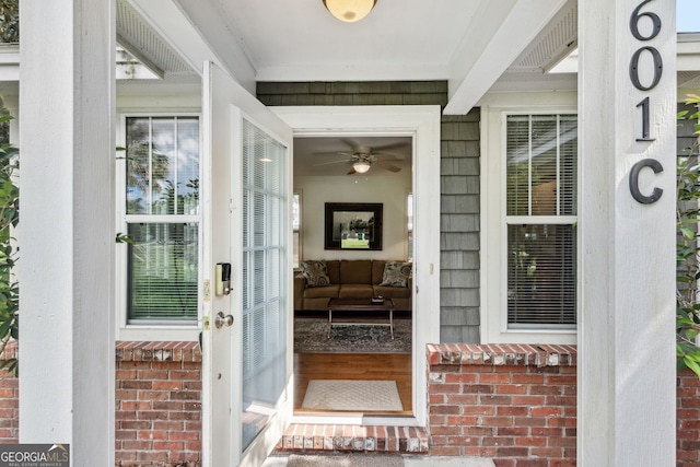 doorway to property featuring brick siding