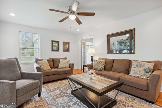 living area with recessed lighting, baseboards, ceiling fan, and wood finished floors