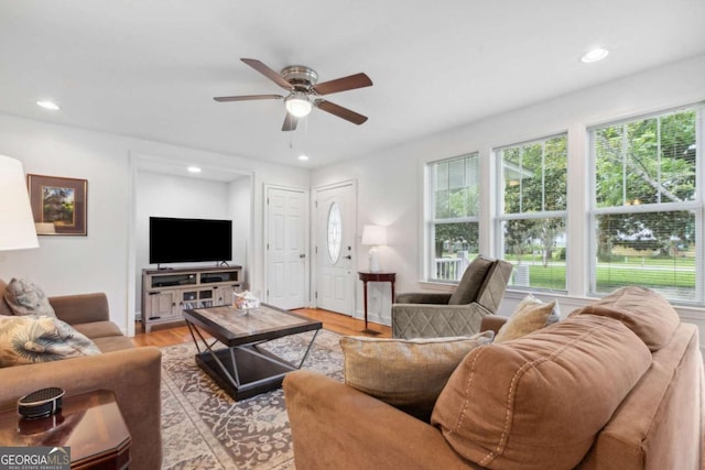 living room with light wood-style flooring, recessed lighting, and ceiling fan