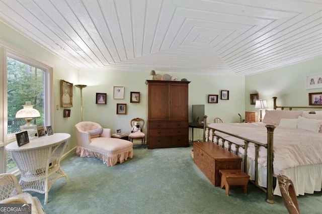 carpeted bedroom featuring wood ceiling