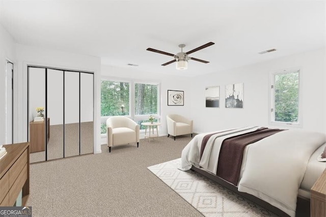 carpeted bedroom featuring ceiling fan