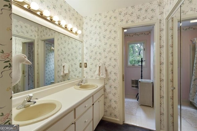 bathroom featuring vanity and radiator heating unit