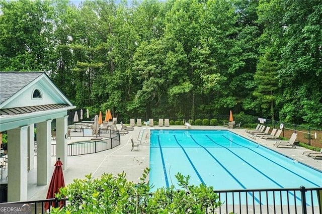 view of swimming pool featuring a patio