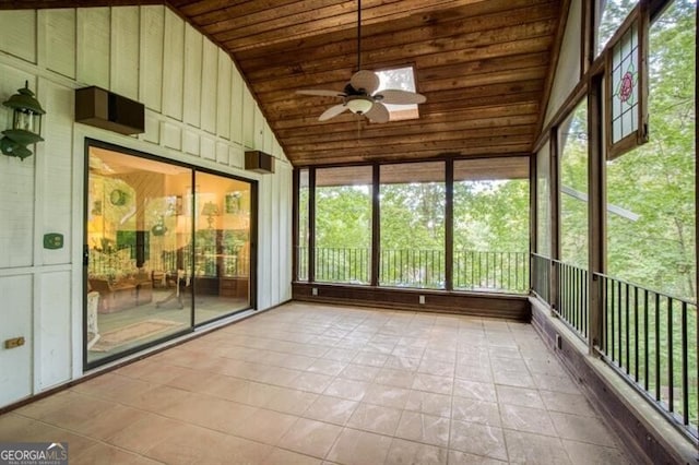 unfurnished sunroom with ceiling fan, wooden ceiling, and vaulted ceiling