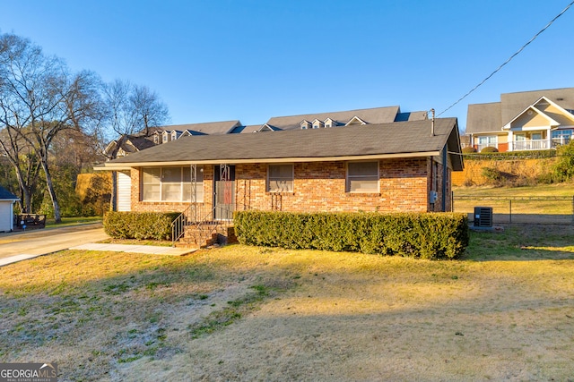 single story home featuring cooling unit