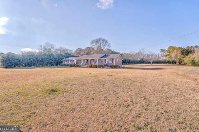 ranch-style home with a front yard