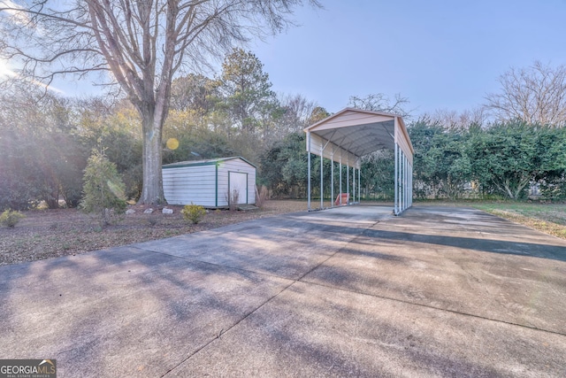 view of patio with a storage unit and a carport