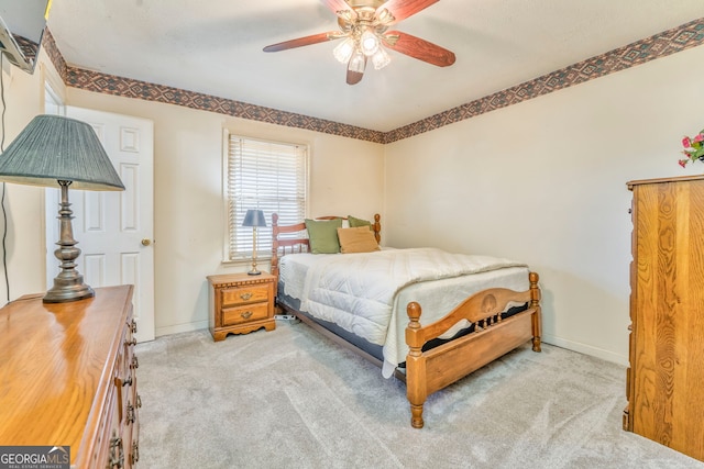 bedroom with ceiling fan and light carpet