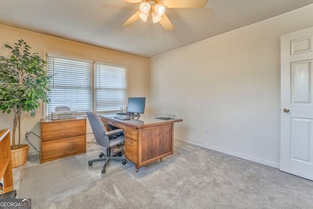 office space with light carpet and ceiling fan