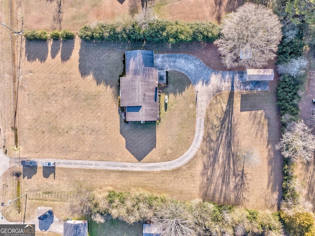 birds eye view of property with a rural view