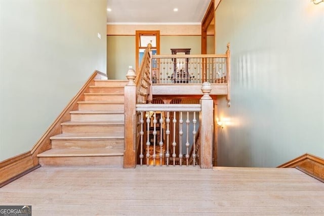 stairs with hardwood / wood-style floors