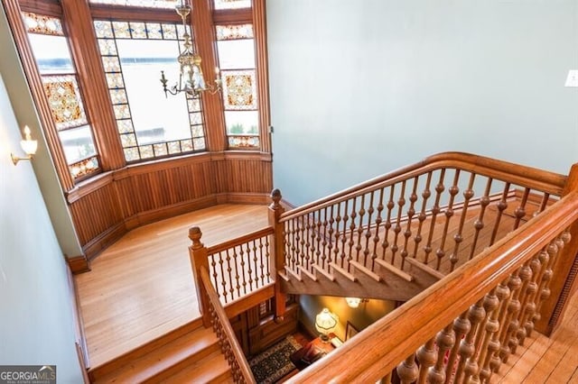 stairway featuring wood-type flooring