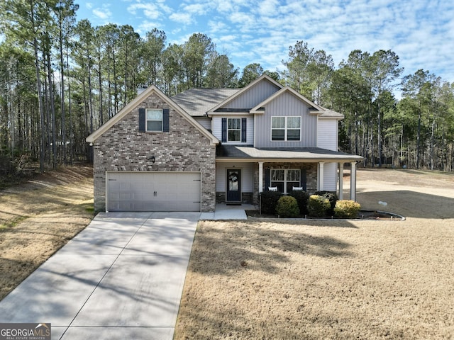 view of front of house featuring a porch and a garage