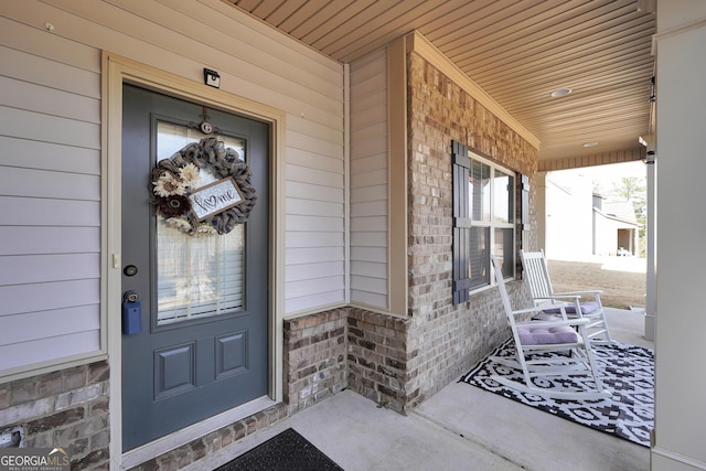 doorway to property featuring a porch