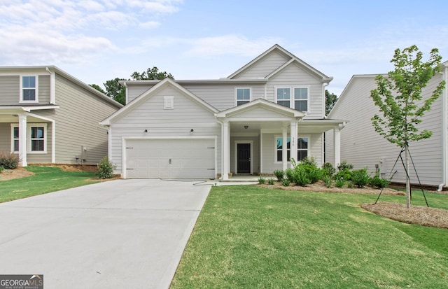 view of front of home with a garage and a front lawn