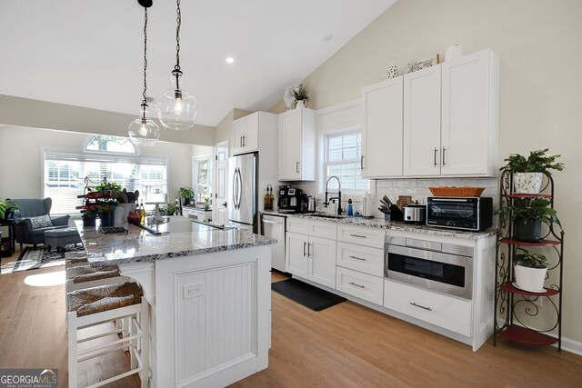 kitchen with white cabinetry, sink, and stainless steel appliances