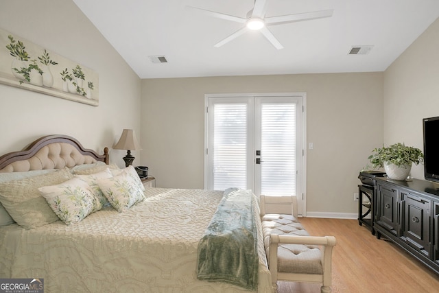 bedroom with multiple windows, french doors, light hardwood / wood-style floors, and ceiling fan