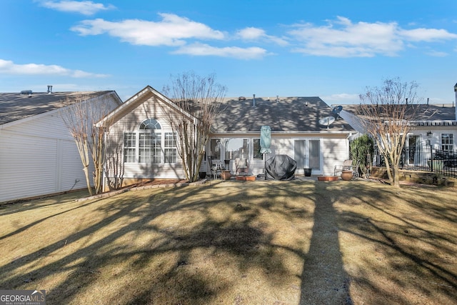 back of house with a yard