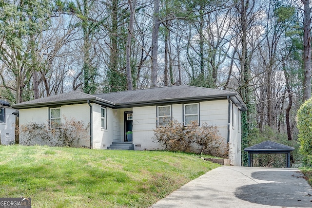 single story home featuring a front lawn and a carport