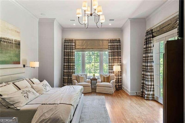 bedroom featuring light hardwood / wood-style floors, crown molding, and a notable chandelier