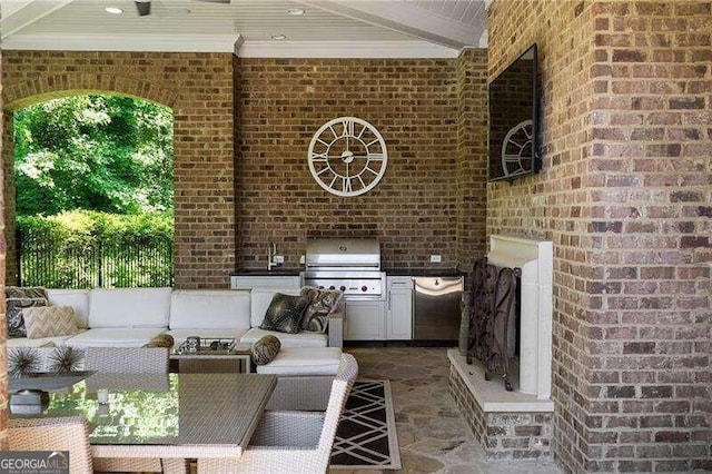 view of patio featuring area for grilling, sink, and an outdoor hangout area