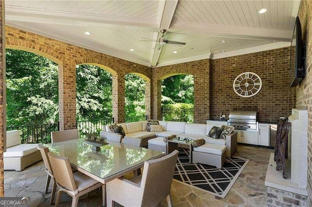 view of patio / terrace with outdoor lounge area, an outdoor kitchen, and grilling area