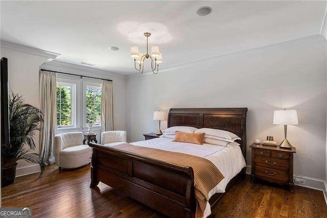 bedroom featuring a chandelier, dark wood-type flooring, and ornamental molding