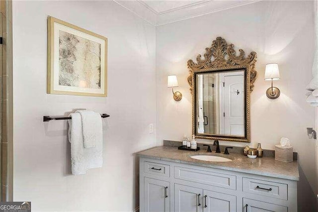 bathroom featuring vanity and ornamental molding