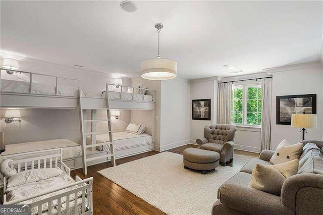 bedroom featuring dark hardwood / wood-style floors and ornamental molding