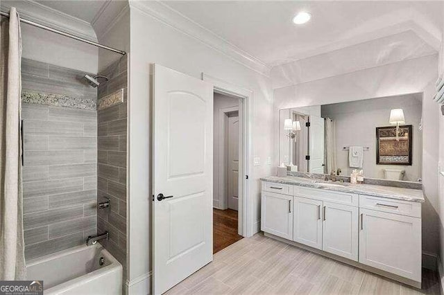 bathroom featuring shower / bathing tub combination, vanity, and crown molding