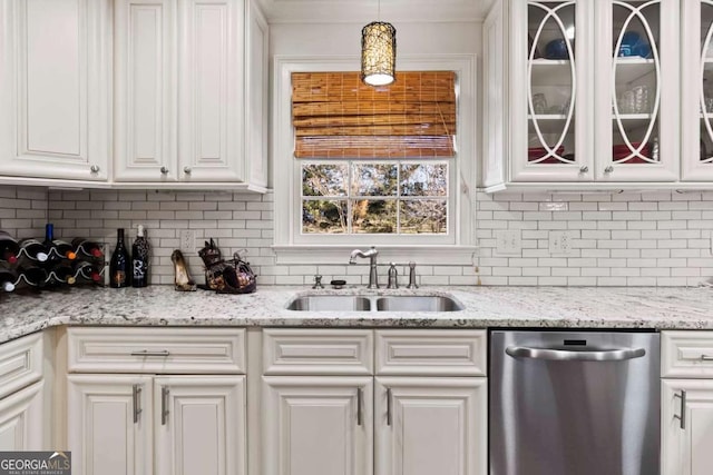 kitchen with white cabinetry, dishwasher, hanging light fixtures, and sink