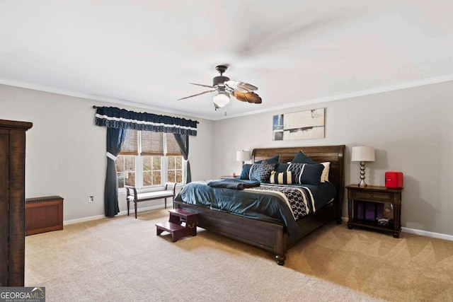 bedroom with ceiling fan, ornamental molding, and light carpet