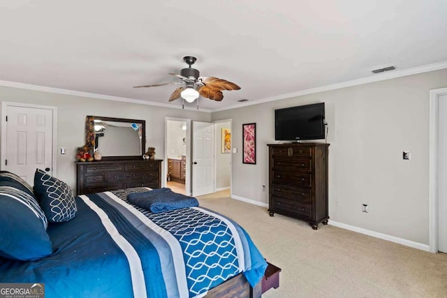 bedroom featuring ceiling fan, crown molding, light colored carpet, and ensuite bathroom