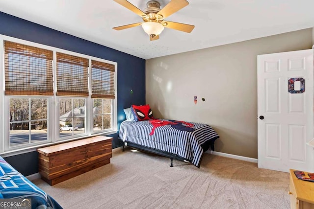 carpeted bedroom with ceiling fan